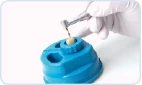 Shaping a root canal on an extracted tooth held in ProTrain
